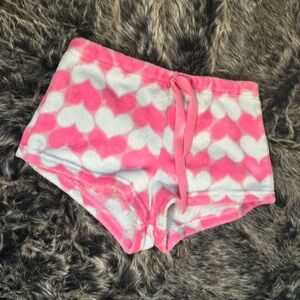 Cute pink and white pajama shorts with hearts.